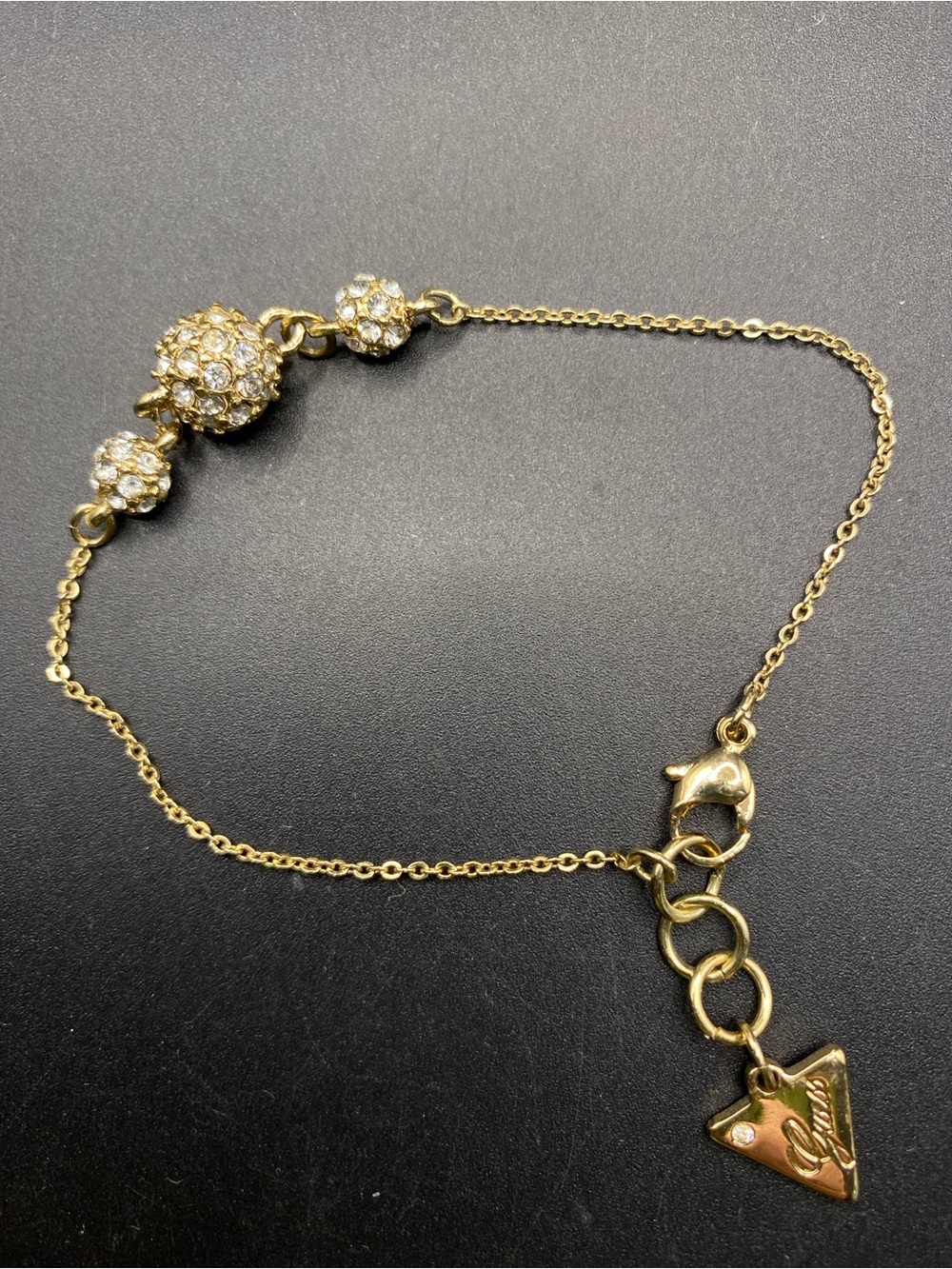 GUESS Gold Tone Pave Crystal Ball Chain Bracelet Triangle Logo Charm